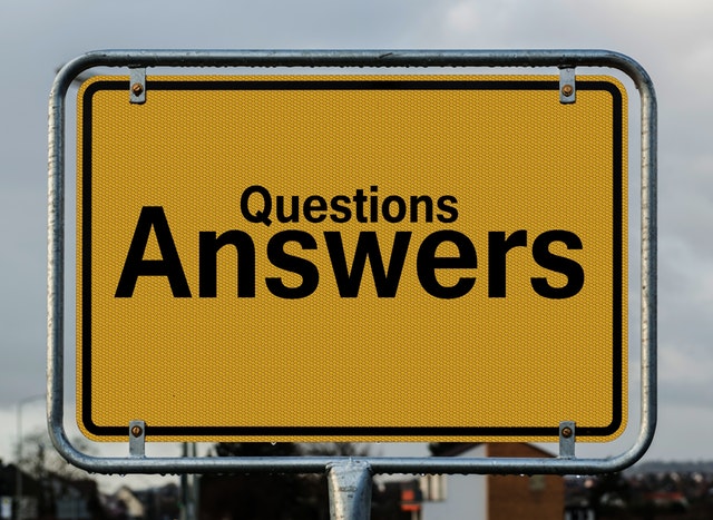 sign with the words questions and answers printed on it