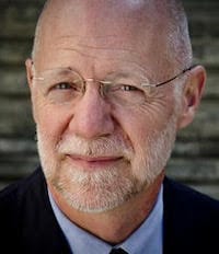 Patrick Duiven's Headshot outdoors with a brick background